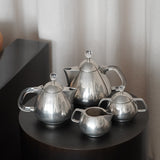 Coffee & Tea Set by Frederick Lunning