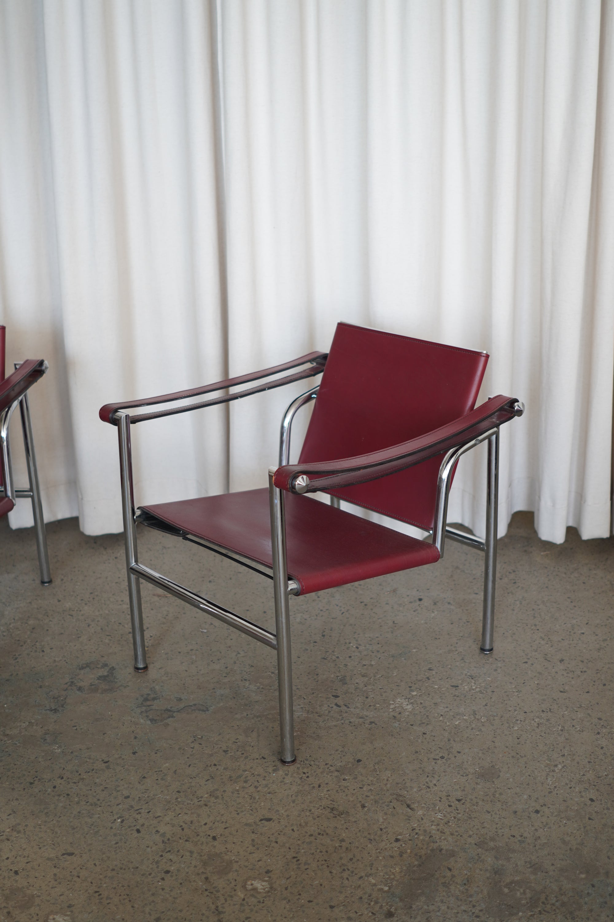 Leather Swivel Back Sling Armchairs