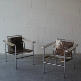 Cowhide Swivel Back Sling Armchairs