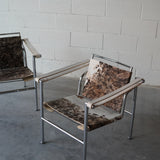 Cowhide Swivel Back Sling Armchairs