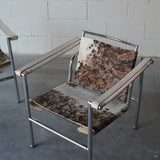 Cowhide Swivel Back Sling Armchairs