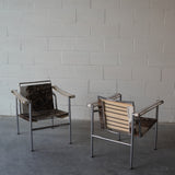 Cowhide Swivel Back Sling Armchairs