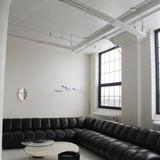 Canapé sectionnel capitonné en cuir