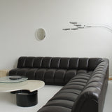 Canapé sectionnel capitonné en cuir